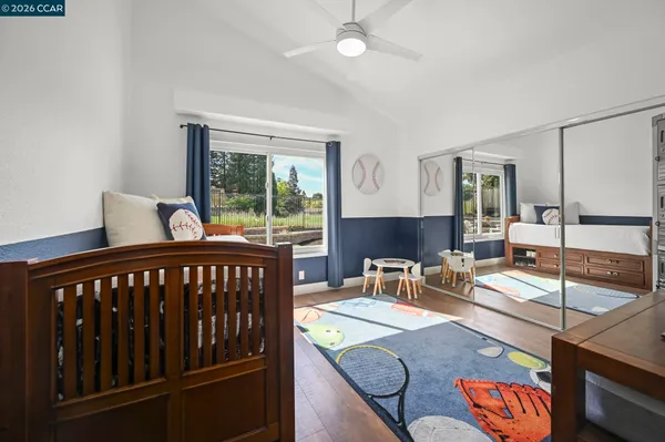 a bedroom with furniture and a window