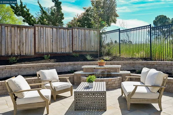 a outdoor living space with furniture and a potted plant