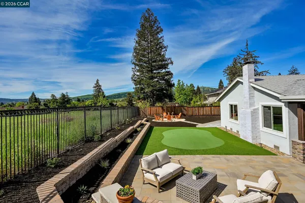 a view of swimming pool with a patio