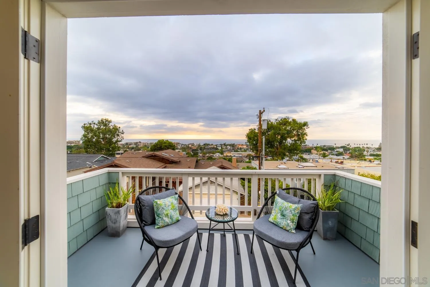 742 Cornish Drive Encinitas, CA 92024 - Photo 12 of 30 a view of a balcony with couch on wooden floor