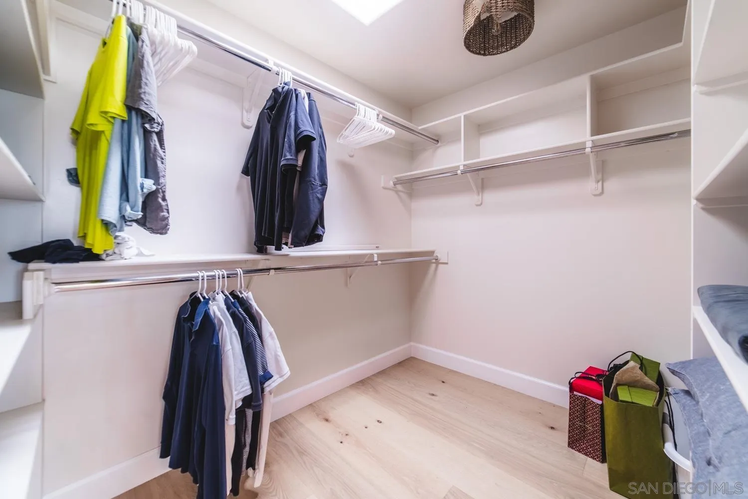 742 Cornish Drive Encinitas, CA 92024 - Photo 15 of 30 a view of walk in closet with clothes and shoes