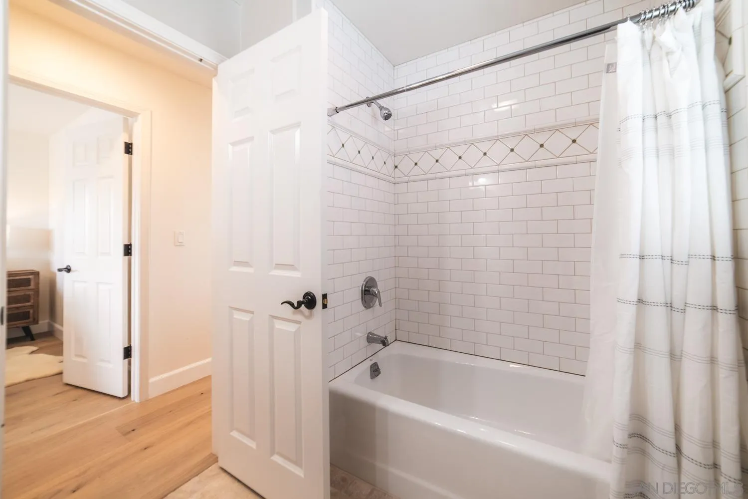 742 Cornish Drive Encinitas, CA 92024 - Photo 19 of 30 a bathroom with a bathtub and a shower
