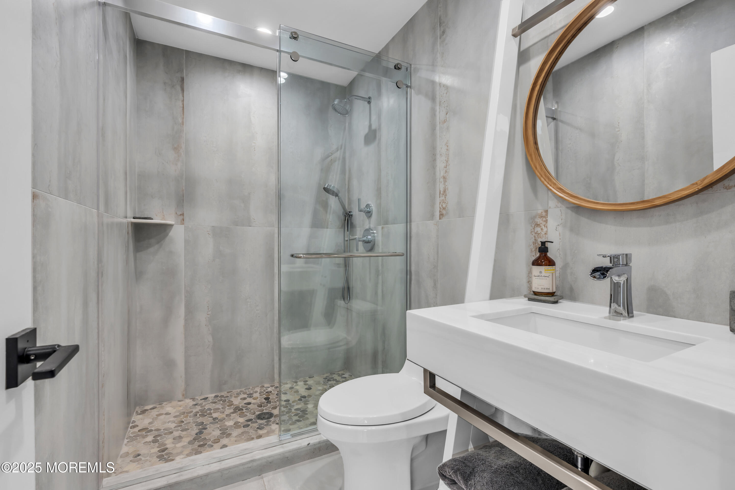 8 Channel Road Toms River, NJ 08753 - Photo 19 of 60 a bathroom with a sink toilet and shower