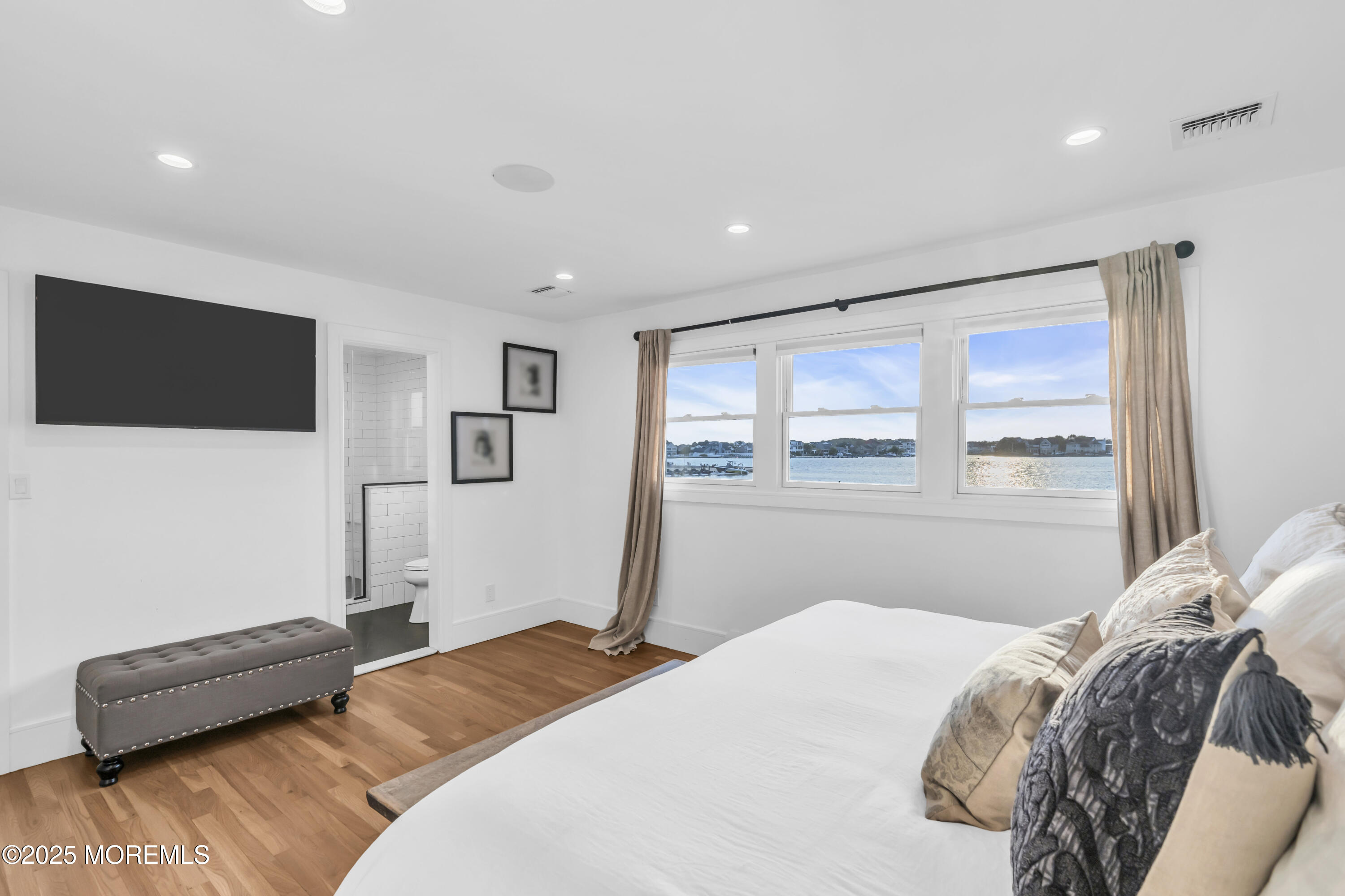 8 Channel Road Toms River, NJ 08753 - Photo 20 of 60 a bedroom with a bed and a flat screen tv