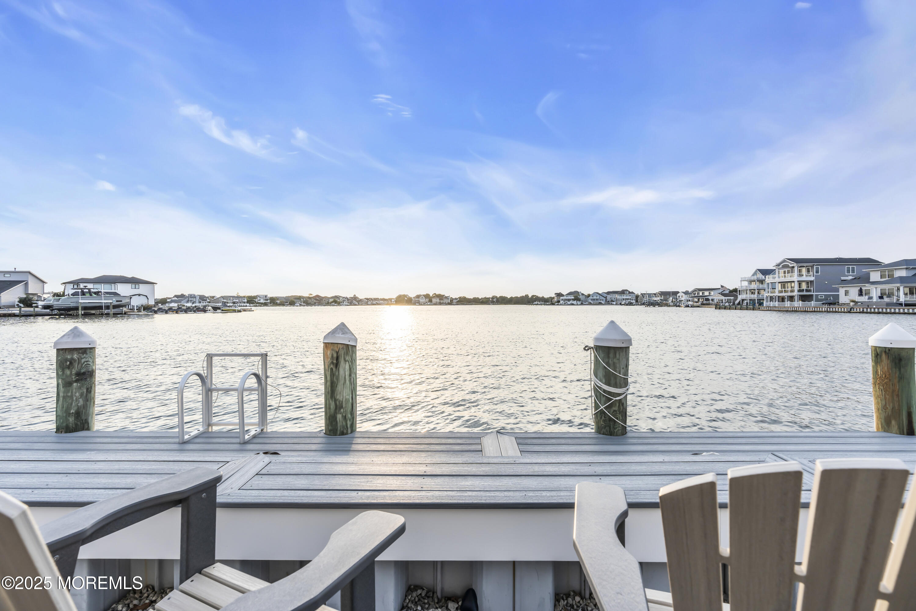 8 Channel Road Toms River, NJ 08753 - Photo 52 of 60 a view of a lake with a table and chairs