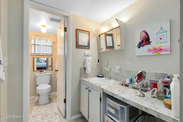 a view of bathroom with a sink and a toilet