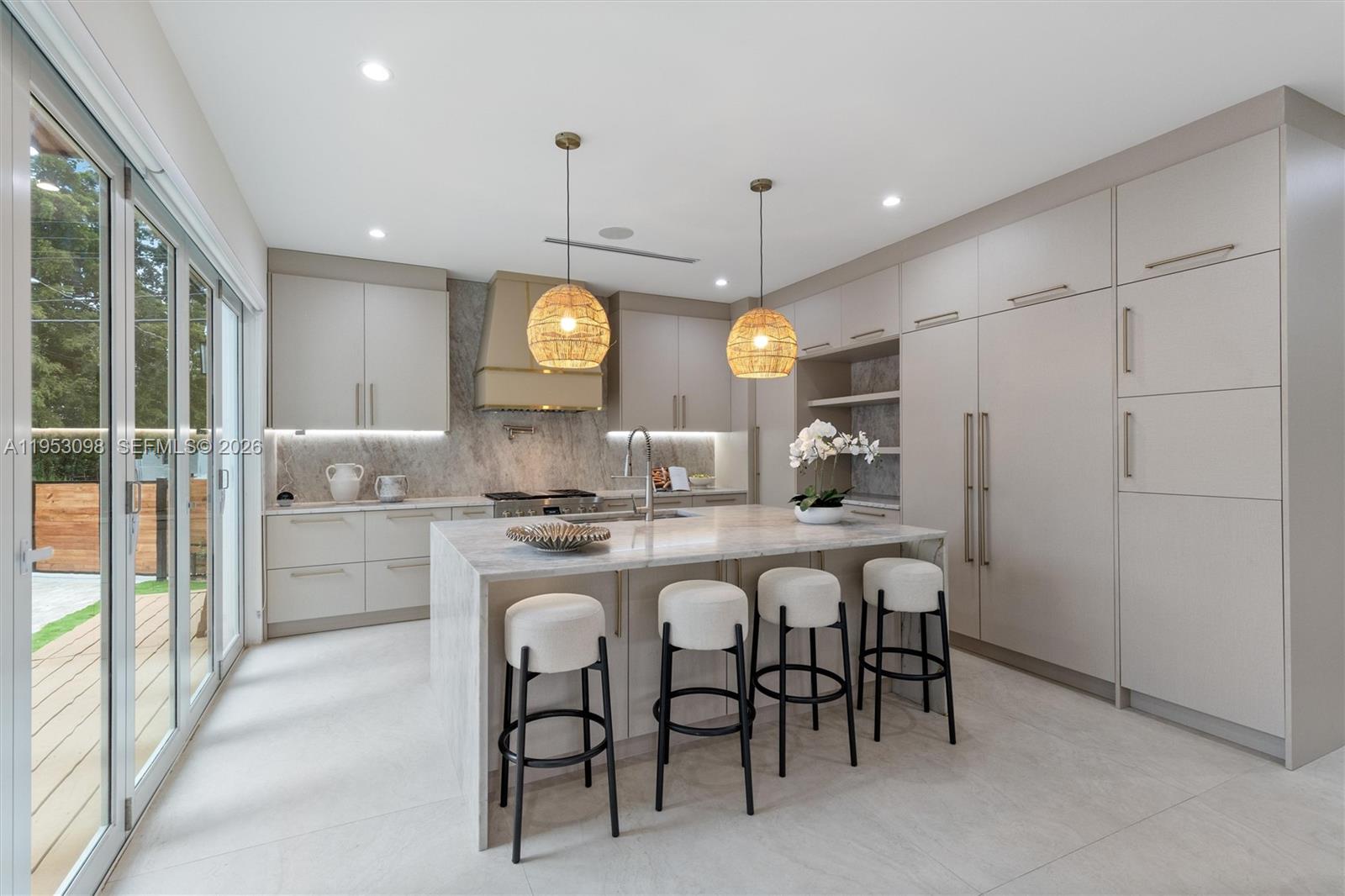 3495 Southwest 3rd Avenue Miami, FL 33145 - Photo 11 of 35 a large kitchen with a table and chairs