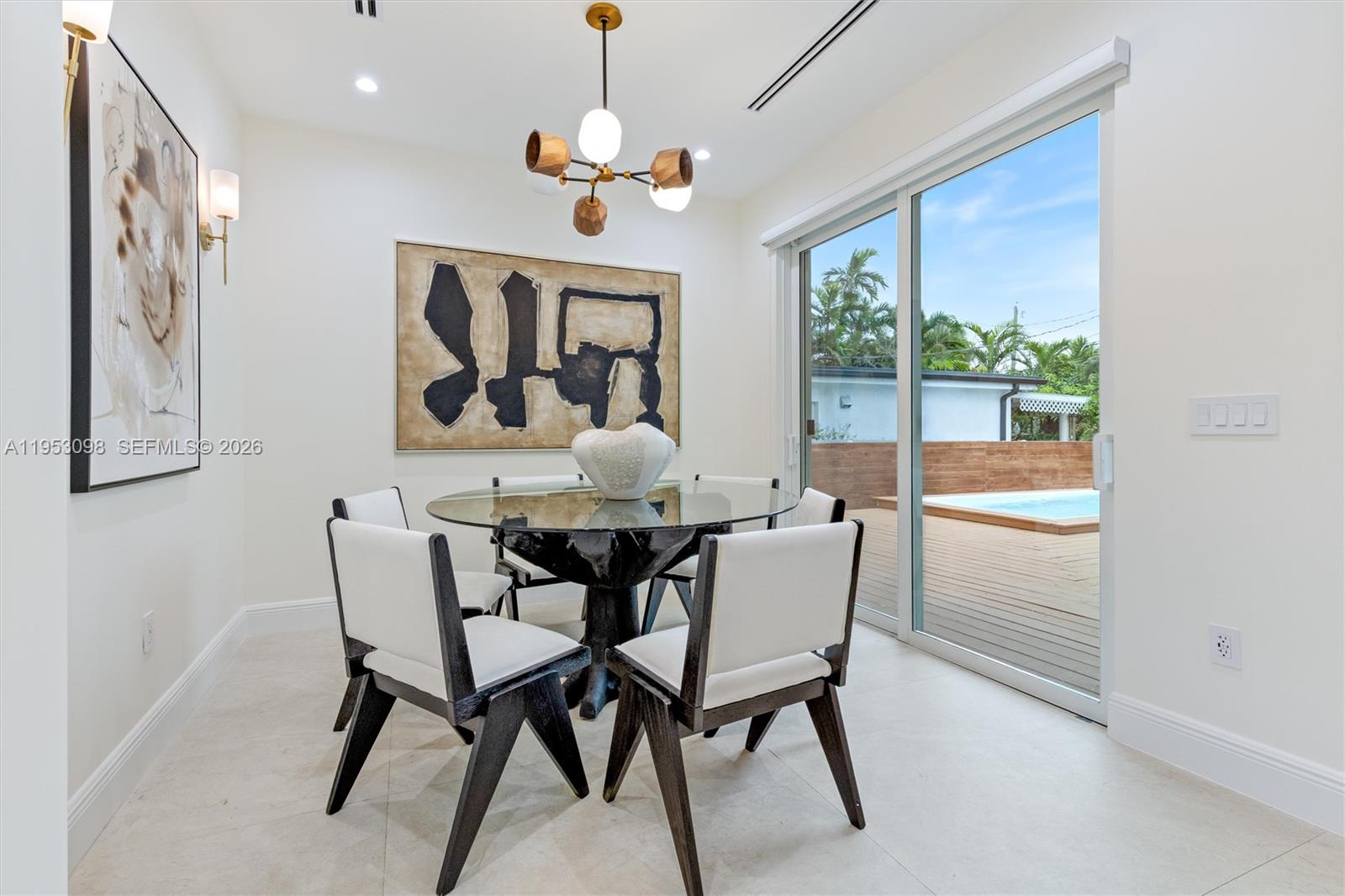 3495 Southwest 3rd Avenue Miami, FL 33145 - Photo 14 of 35 a dining room with furniture a chandelier and window