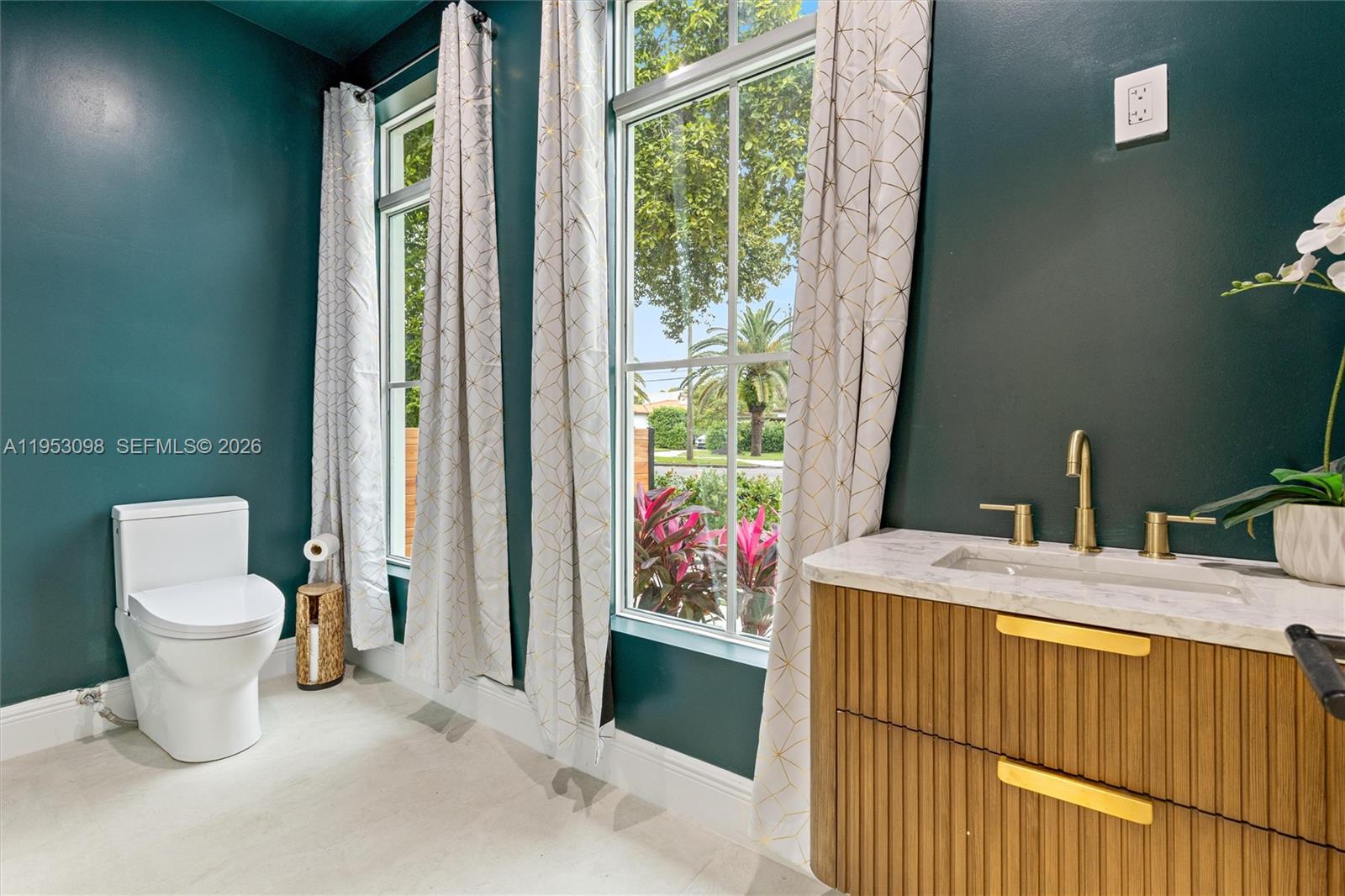 3495 Southwest 3rd Avenue Miami, FL 33145 - Photo 21 of 35 a bathroom with a sink toilet and window