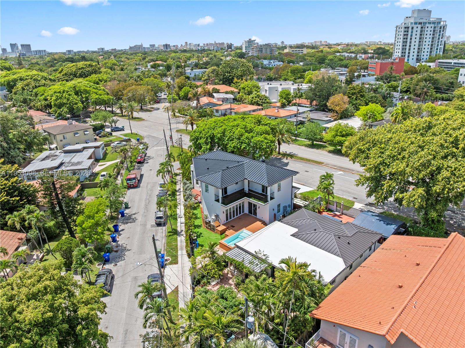 3495 Southwest 3rd Avenue Miami, FL 33145 - Photo 32 of 35 an aerial view of multiple houses with yard