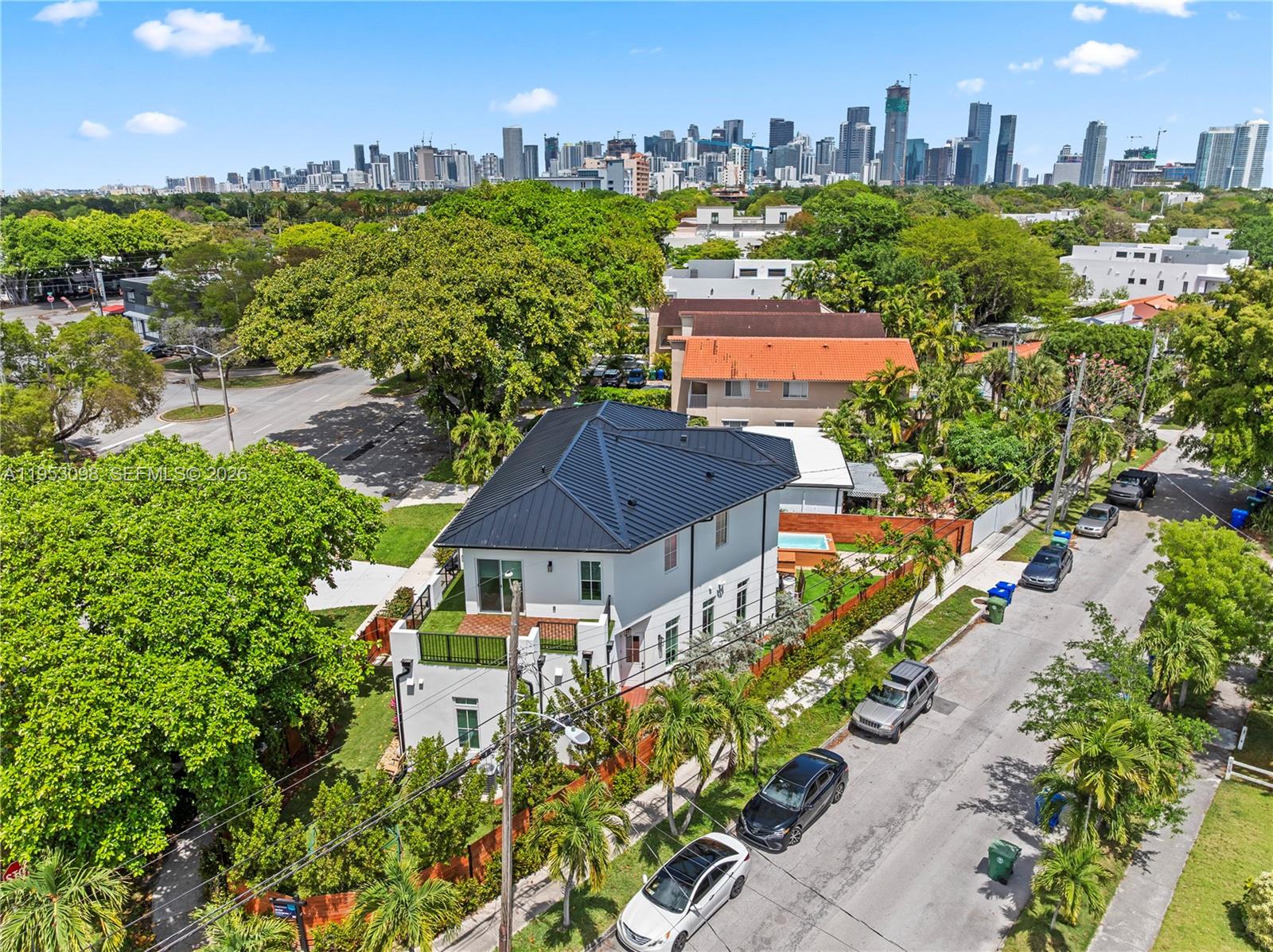 3495 Southwest 3rd Avenue Miami, FL 33145 - Photo 5 of 35 an aerial view of a house with a yard and lake view