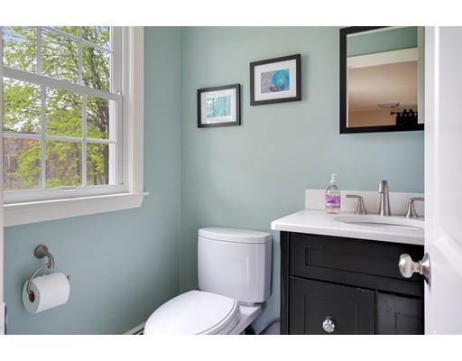 11 Glover Road Needham, MA 02494 - Photo 11 of 24 a bathroom with a toilet a sink and mirror