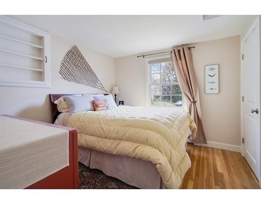 11 Glover Road Needham, MA 02494 - Photo 13 of 24 a bedroom with a bed and a window