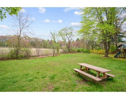11 Glover Road Needham, MA 02494 - Photo 20 of 24 a backyard of a house with lots of green space