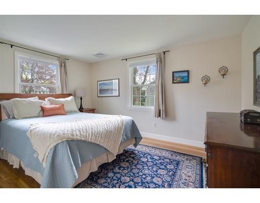 11 Glover Road Needham, MA 02494 - Photo 10 of 24 a bedroom with a bed and a window
