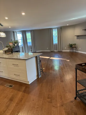 a view of a room with kitchen island