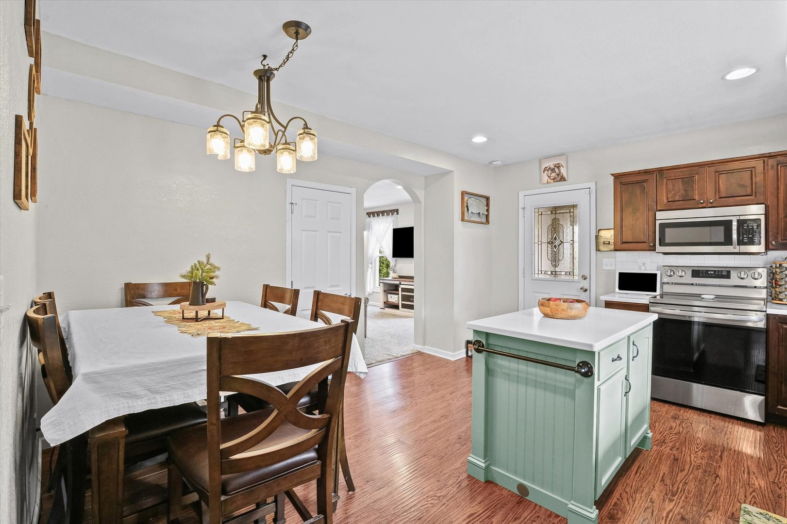 107 Washington Street Congerville, IL 61729 - Photo 13 of 39 a view of a dining room with furniture wooden floor and chandelier