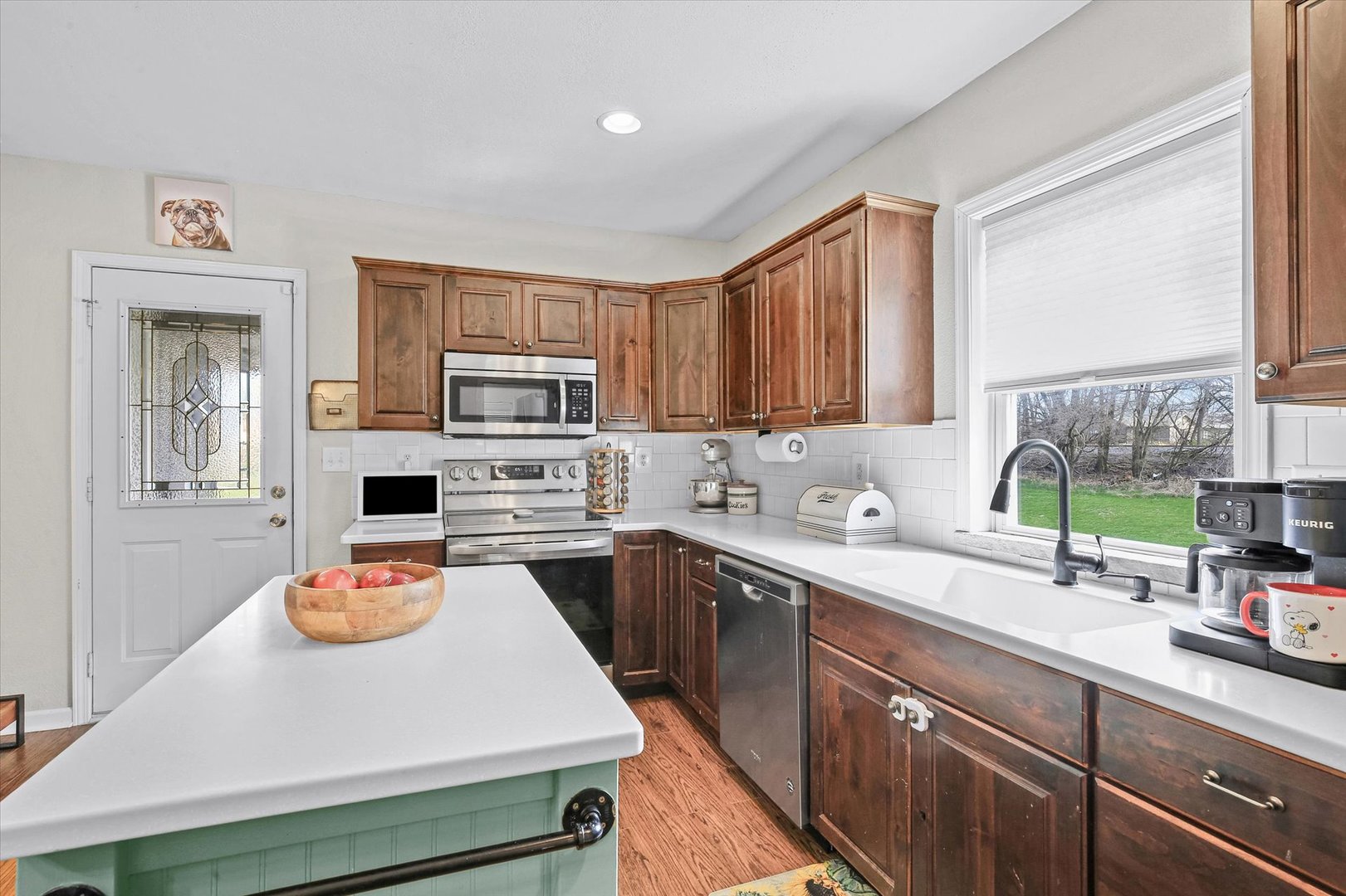 107 Washington Street Congerville, IL 61729 - Photo 15 of 39 a kitchen with a sink a stove and cabinets
