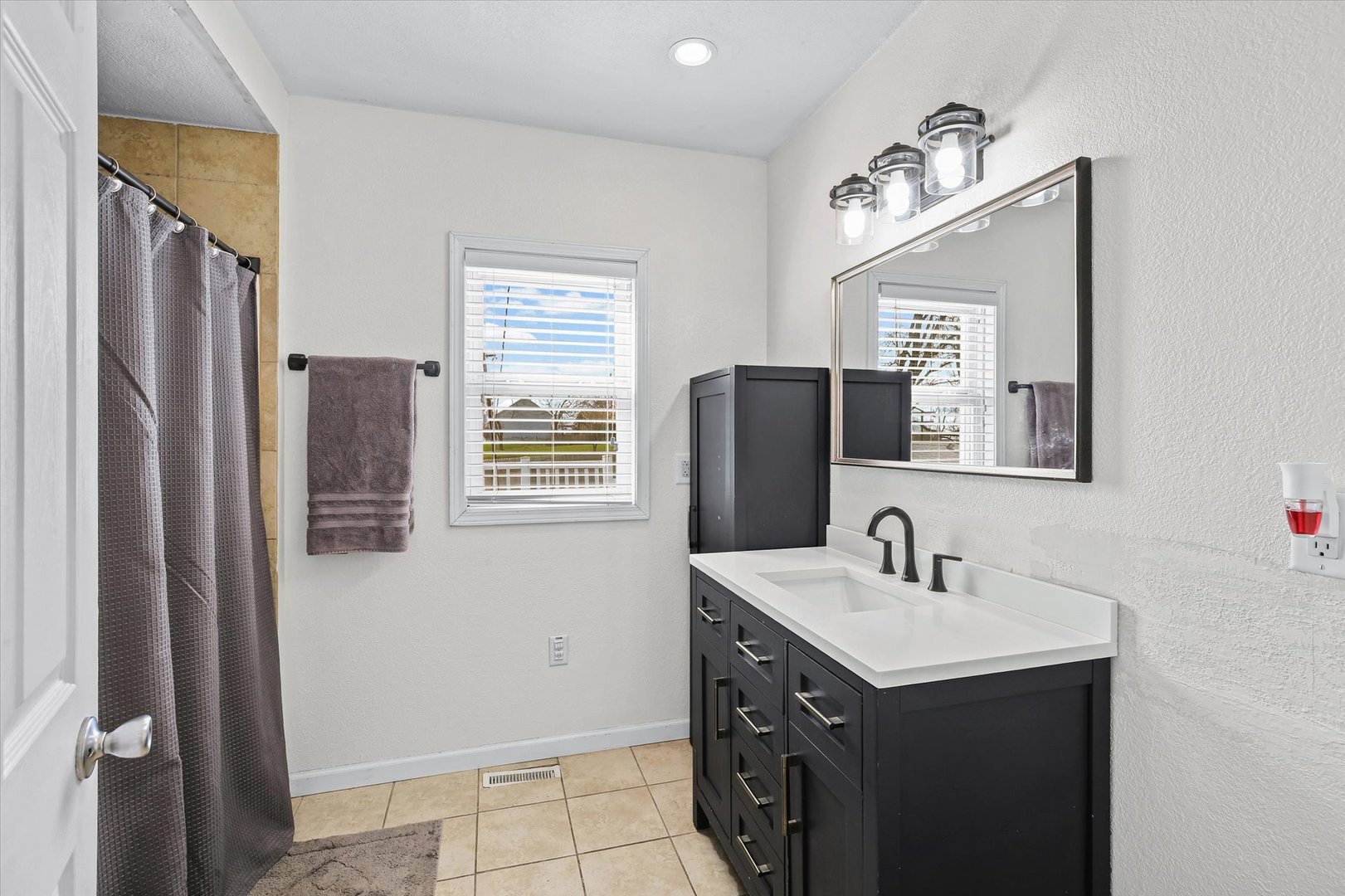 107 Washington Street Congerville, IL 61729 - Photo 20 of 39 a bathroom with a sink vanity and a mirror
