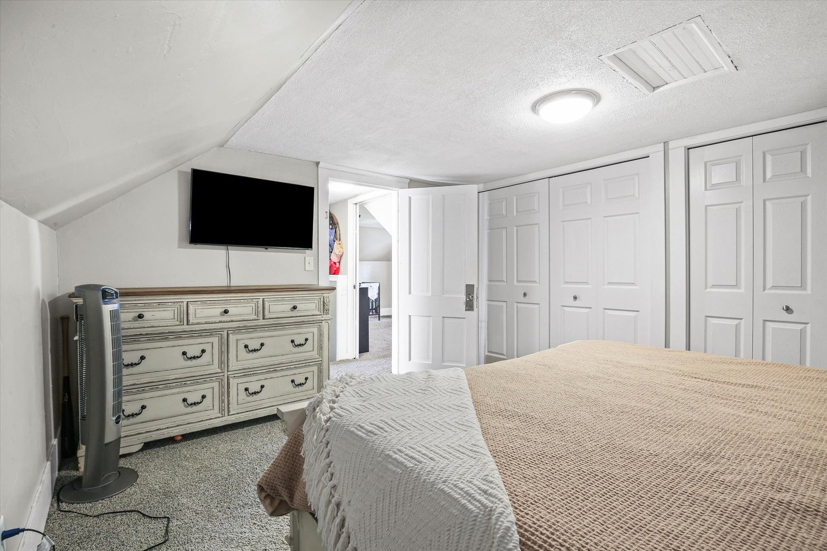 107 Washington Street Congerville, IL 61729 - Photo 27 of 39 a bedroom with a bed and a flat screen tv in it