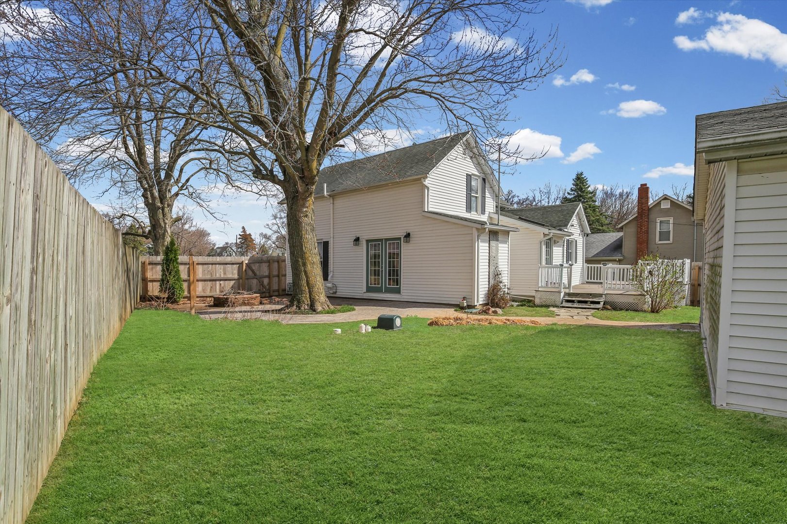 107 Washington Street Congerville, IL 61729 - Photo 35 of 39 a view of a house with backyard and a tree