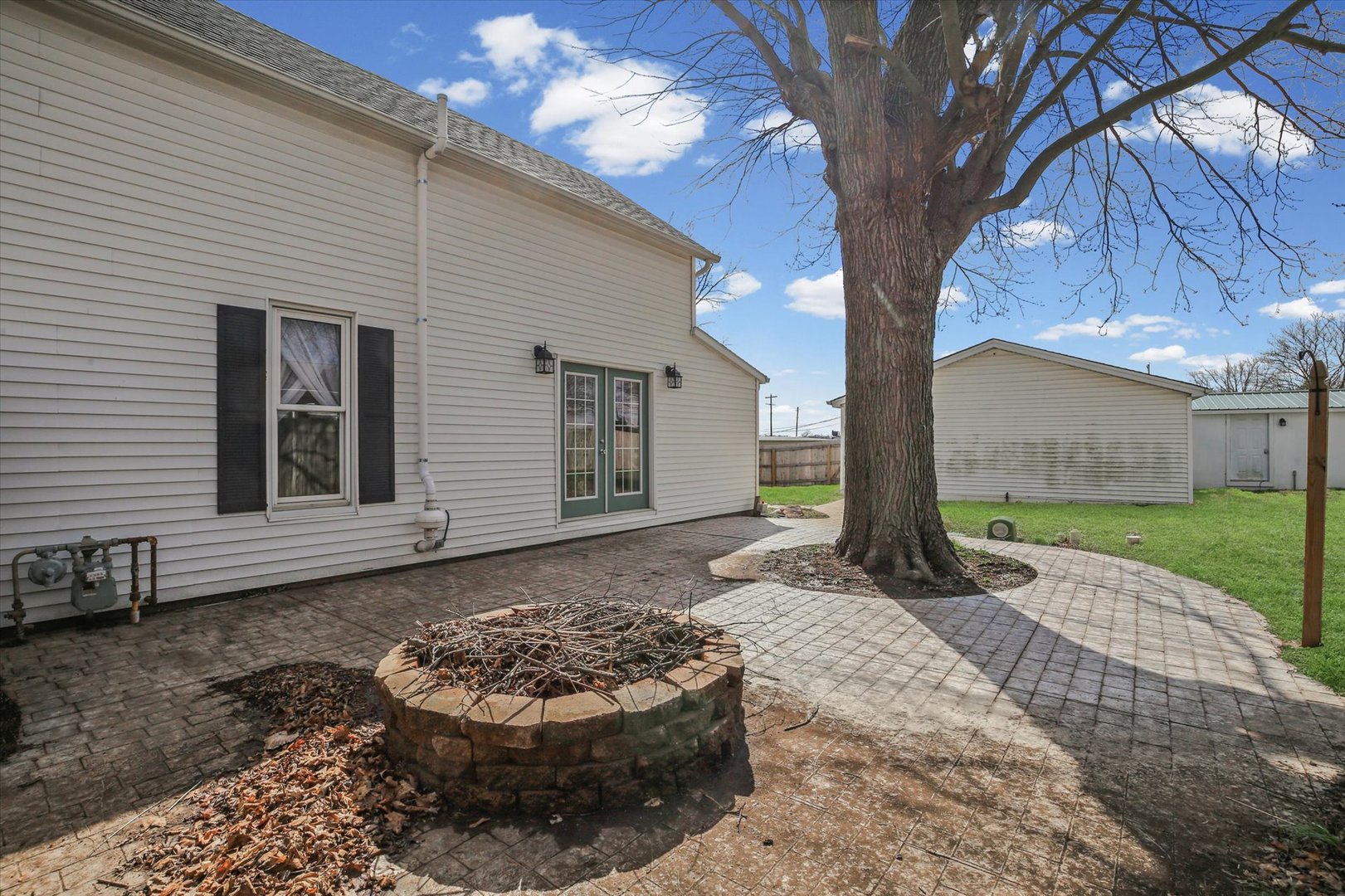 107 Washington Street Congerville, IL 61729 - Photo 36 of 39 a view of a backyard with a large tree