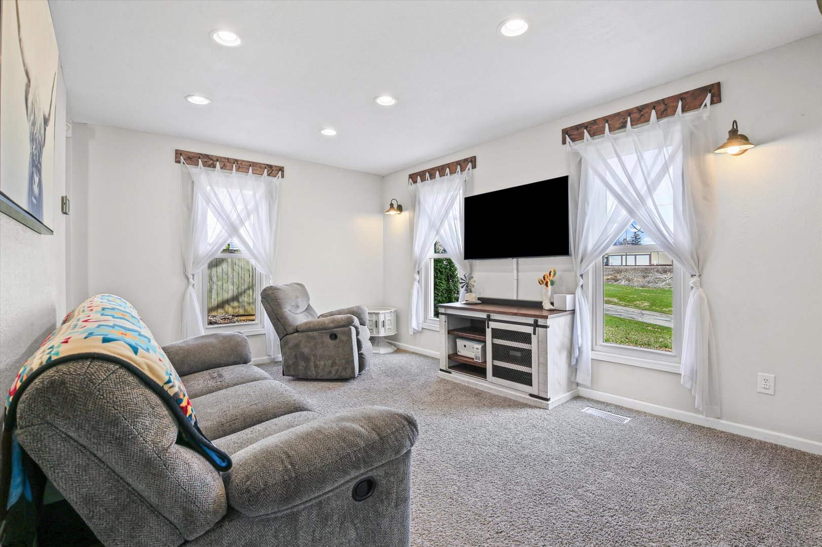 107 Washington Street Congerville, IL 61729 - Photo 8 of 39 a living room with furniture and a flat screen tv