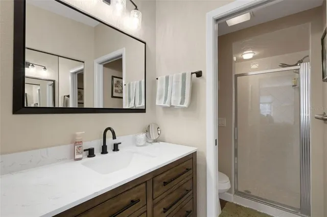 a bathroom with a double vanity sink mirror and