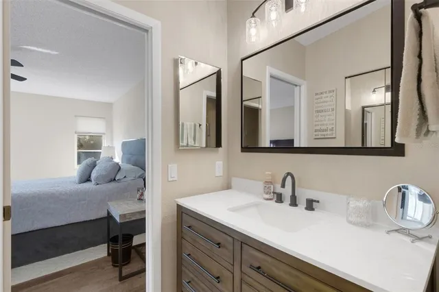 a en suite bathroom with double vanity sinks and a mirror