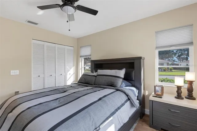 a bedroom with a bed and window