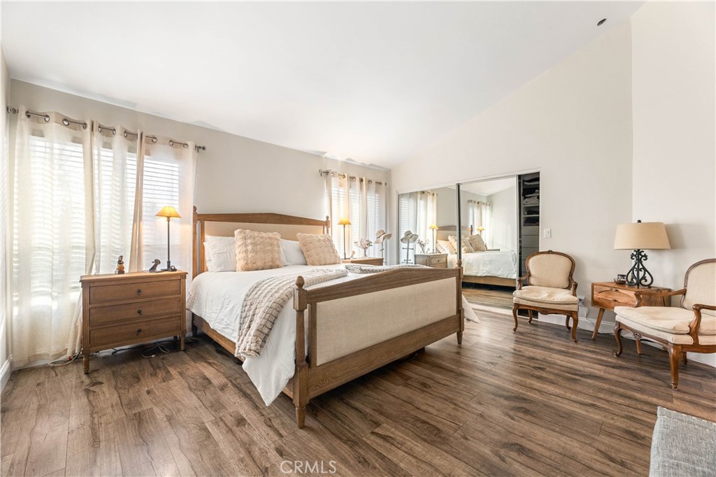 18146 Oxnard Street, Unit 48 Tarzana, CA 91356 - Photo 18 of 52 a bed room with a bed and a chair