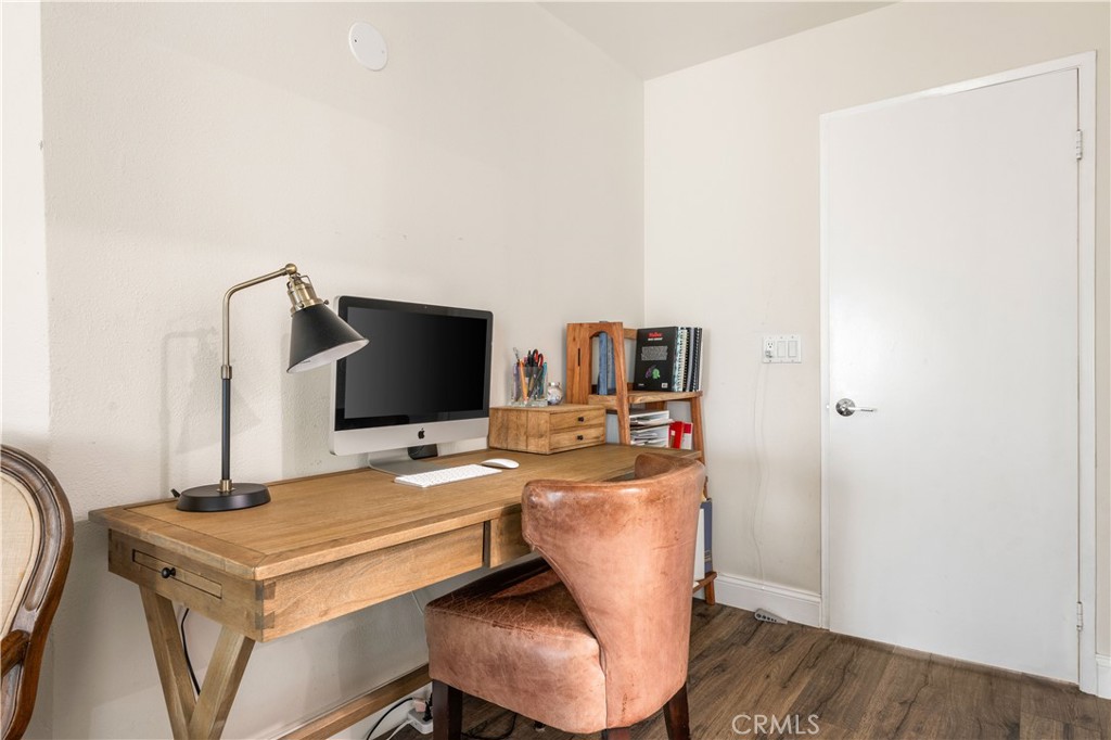 18146 Oxnard Street, Unit 48 Tarzana, CA 91356 - Photo 21 of 52 a room with furniture and a flat screen tv