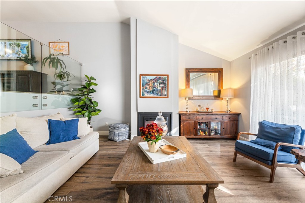 18146 Oxnard Street, Unit 48 Tarzana, CA 91356 - Photo 4 of 52 a living room with furniture fireplace and a window
