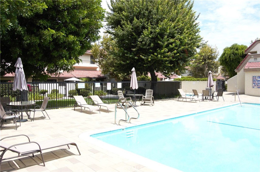 18146 Oxnard Street, Unit 48 Tarzana, CA 91356 - Photo 45 of 52 a view of a swimming pool with outdoor seating