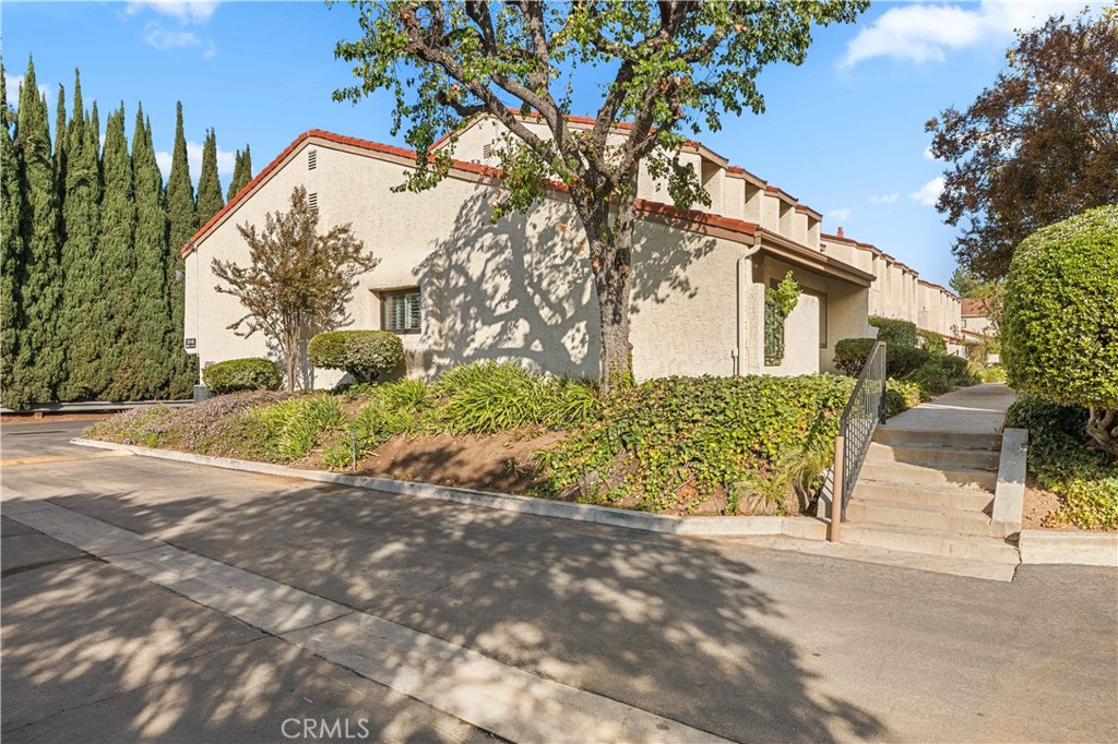18146 Oxnard Street, Unit 48 Tarzana, CA 91356 - Photo 51 of 52 a view of a house with a street