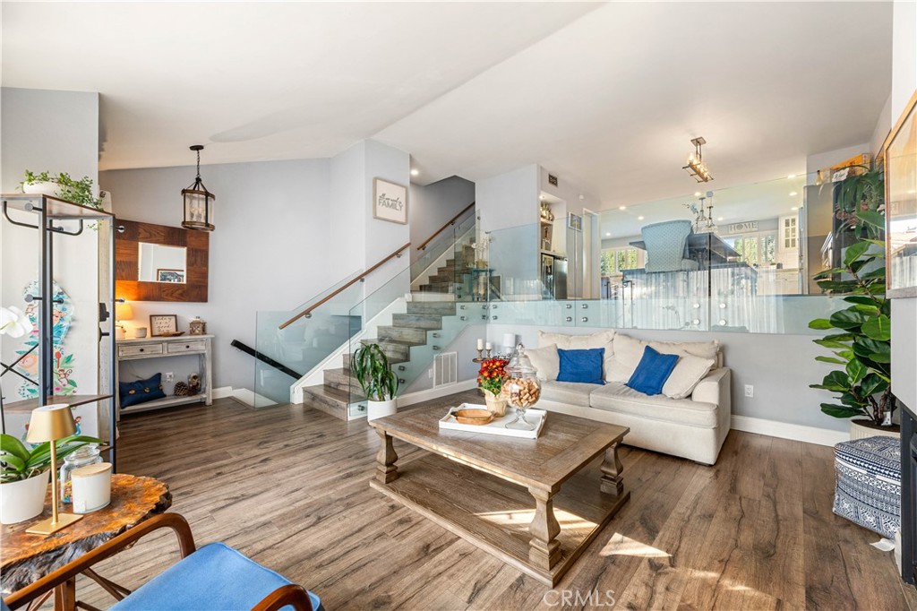 18146 Oxnard Street, Unit 48 Tarzana, CA 91356 - Photo 6 of 52 a living room with furniture and wooden floor