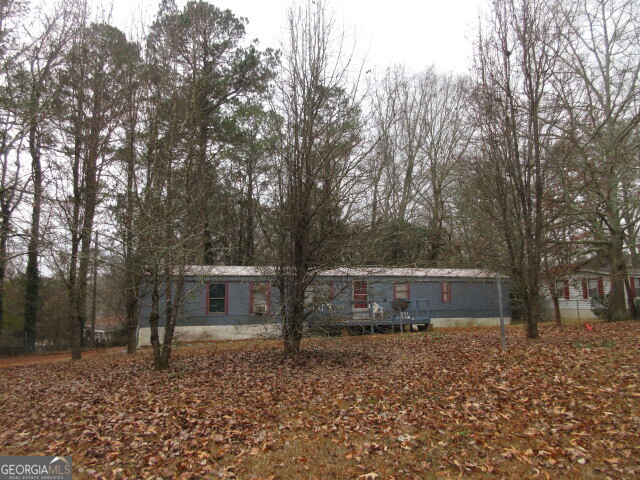 220 Millers Mill Road Stockbridge, GA 30281 - Photo 1 of 3 a view of house with trees in the background