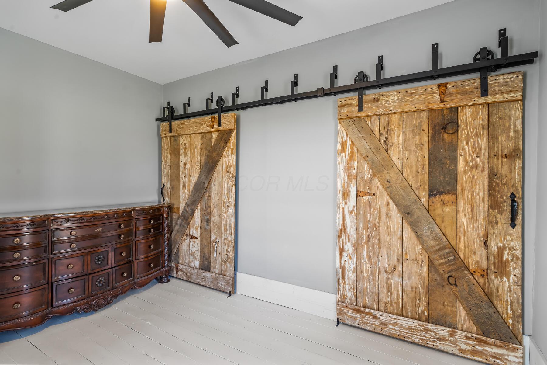 7277 Condit Road Centerburg, OH 43011 - Photo 18 of 41 Barn doors hide His & Her closets