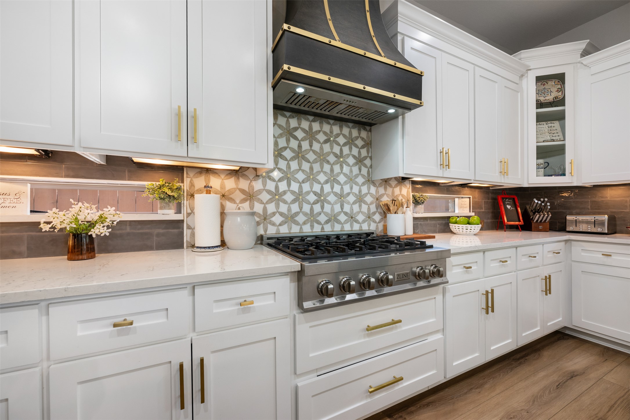 3021 Wedgescale Pass Leander, TX 78641 - Photo 10 of 40 a kitchen with white cabinets and appliances