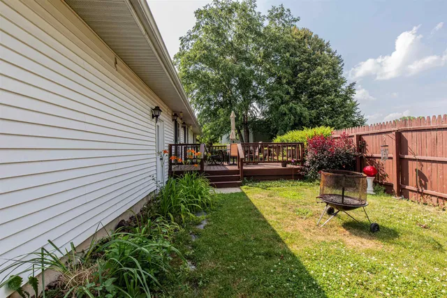 a view of a backyard with sitting area