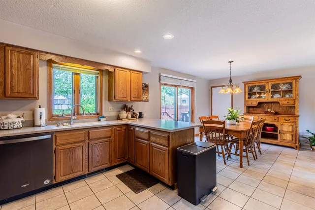 a large kitchen with lots of table and chairs
