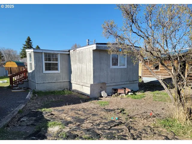 a backyard of a house with seating space