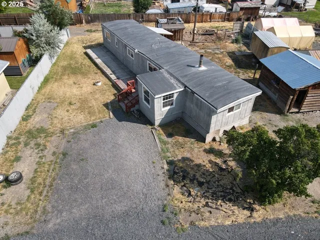 a aerial view of a house with a yard
