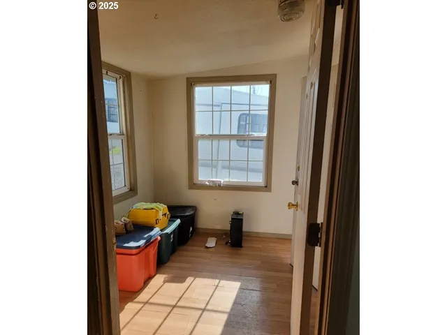 a very nice looking room with a chair and next to a window