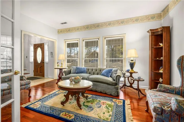 a living room with furniture rug and window