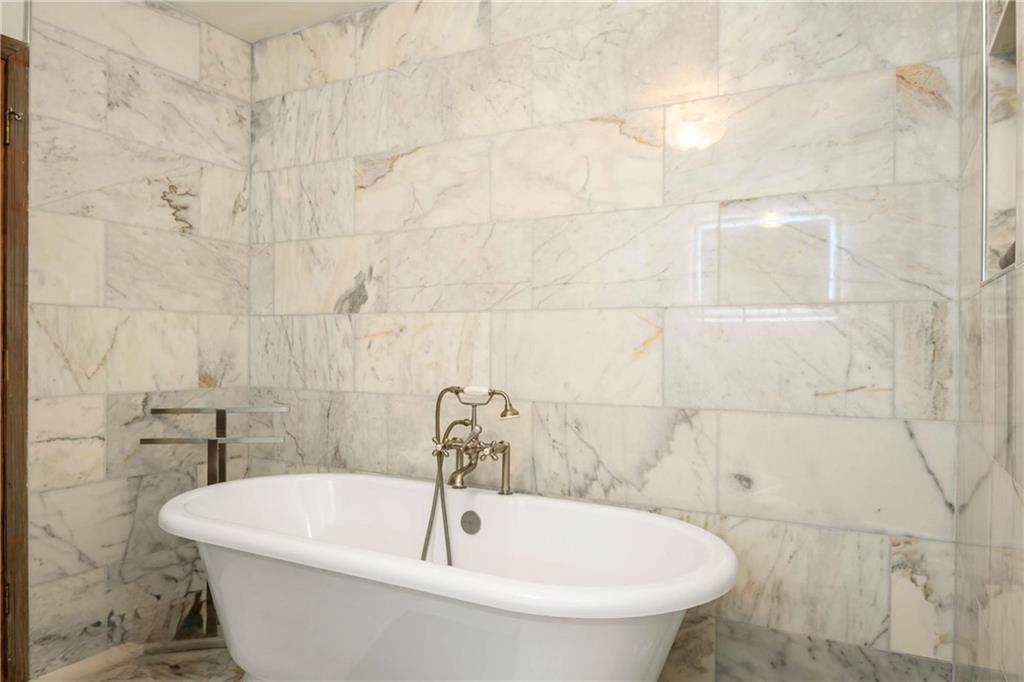 614 Robinson Avenue Southeast Atlanta, GA 30312 - Photo 20 of 74 a white bath tub sitting in a bathroom