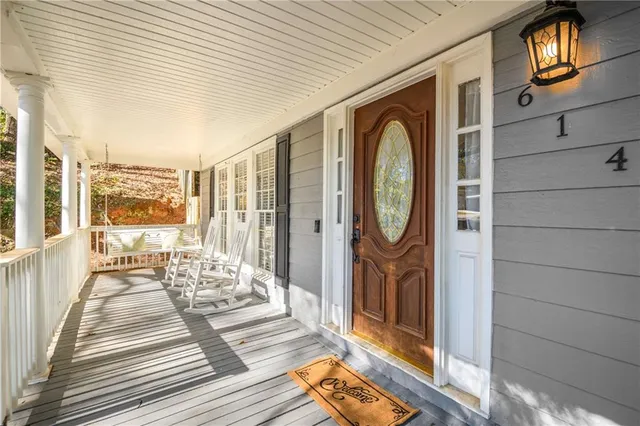 a front view of a house with outdoor seating