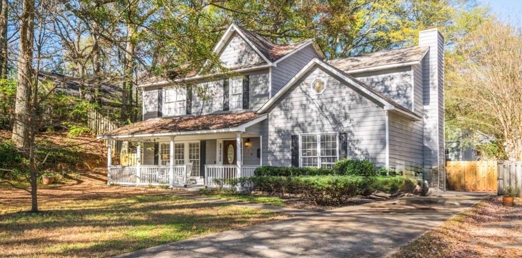 614 Robinson Avenue Southeast Atlanta, GA 30312 - Photo 35 of 74 a view of a white house next to a yard with plants and trees