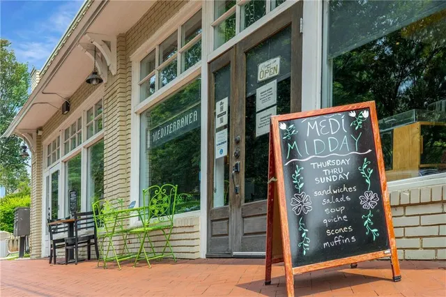 a view of a building with sitting area