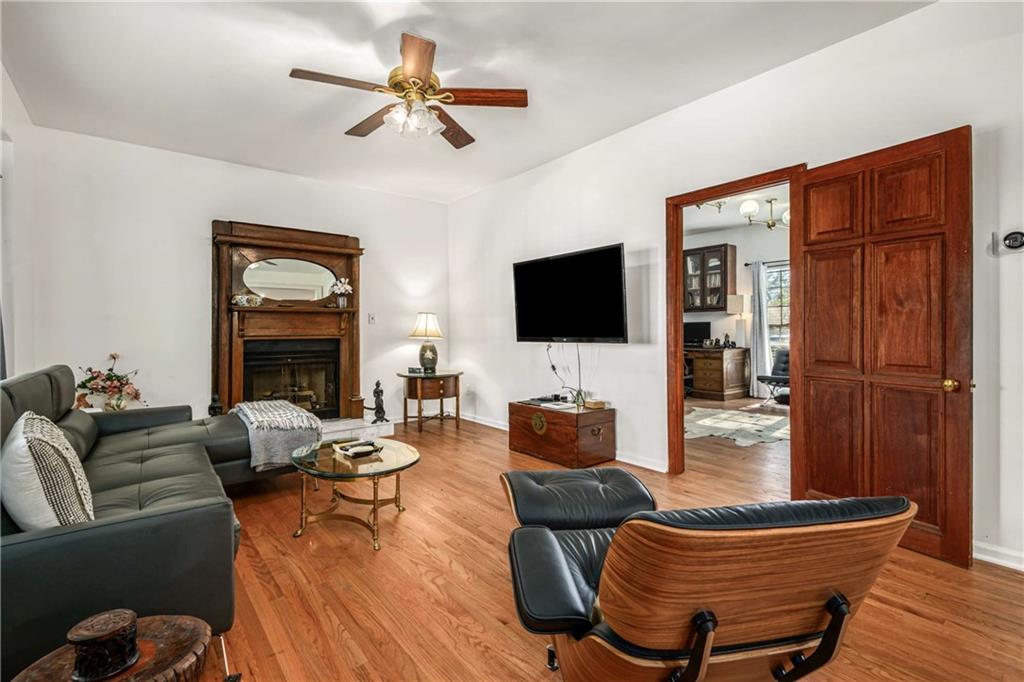 614 Robinson Avenue Southeast Atlanta, GA 30312 - Photo 7 of 74 a living room with furniture a ceiling fan a flat screen tv and a window